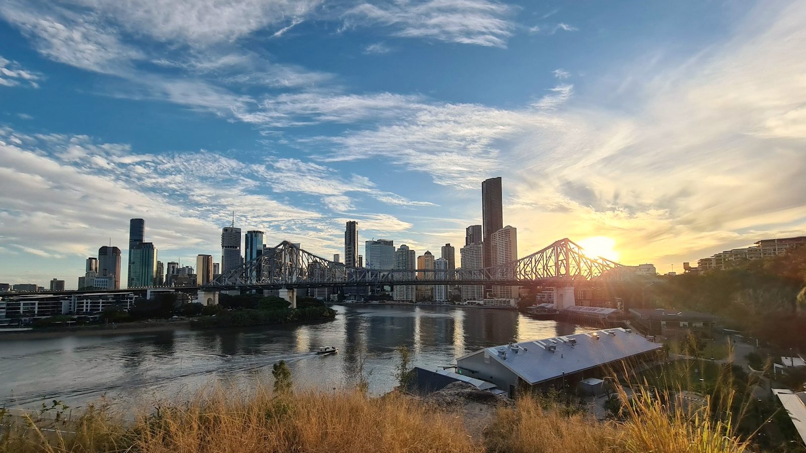 The Story Bridge and Brisbane city skyline at sunset